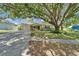 Charming single-story home featuring a well-maintained front yard, attached garage and mature shade tree at 1207 Oak Valley Dr, Seffner, FL 33584