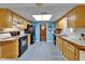 Functional kitchen featuring wooden cabinets, black appliances, and a spacious layout at 1207 Oak Valley Dr, Seffner, FL 33584