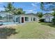Back of house with screened pool, storage shed and partial privacy fence at 1207 Oak Valley Dr, Seffner, FL 33584