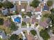 Residential area featuring neatly arranged houses with manicured lawns and mature trees from a birds-eye perspective at 12506 Twisted Oak Dr, Tampa, FL 33624