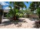 Paver patio and landscaping create a serene outdoor space in the backyard at 12506 Twisted Oak Dr, Tampa, FL 33624