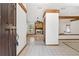 Inviting entryway with decorative tile flooring, stone fireplace and exposed beam accents at 12506 Twisted Oak Dr, Tampa, FL 33624