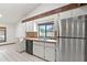 Bright kitchen with stainless steel appliances and tile countertops at 12506 Twisted Oak Dr, Tampa, FL 33624