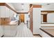 Well-lit kitchen with white cabinets, tiled backsplash, and modern appliances at 12506 Twisted Oak Dr, Tampa, FL 33624