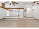 Expansive living room with tile flooring, wood beams, and an open layout at 12506 Twisted Oak Dr, Tampa, FL 33624