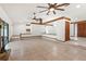 Large, open living room featuring raised areas, unique architectural details, and tile flooring at 12506 Twisted Oak Dr, Tampa, FL 33624
