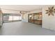 Spacious screened in lanai with ceiling fan and access to the backyard and interior at 12506 Twisted Oak Dr, Tampa, FL 33624