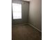 Cozy bedroom with neutral walls, carpet flooring, and a window for natural light at 12820 Belvedere Song Way Way, Riverview, FL 33578