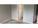 View of a bedroom, showing the entryway and connecting rooms at 12820 Belvedere Song Way Way, Riverview, FL 33578