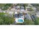 Overhead view of a modern home with a backyard pool and well-maintained landscaping at 1413 E 108Th Ave, Tampa, FL 33612