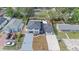 Overhead view of a modern home featuring a long driveway and a fenced backyard at 1413 E 108Th Ave, Tampa, FL 33612