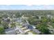 An aerial view showcasing the neighborhood and updated home exterior at 1413 E 108Th Ave, Tampa, FL 33612