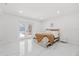Bright bedroom featuring modern interiors, double doors and light-colored marble floors at 1413 E 108Th Ave, Tampa, FL 33612
