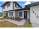 The front of the home features a well-maintained yard and walkway, leading to an inviting entryway at 1413 E 108Th Ave, Tampa, FL 33612