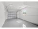The spacious garage has an epoxy floor and new garage door at 1413 E 108Th Ave, Tampa, FL 33612