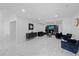 A luxurious living room with sleek marble floors, a modern fireplace, and elegant decor at 1413 E 108Th Ave, Tampa, FL 33612
