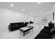 Open-plan living room with marble floors and modern decor featuring furniture with gold accents at 1413 E 108Th Ave, Tampa, FL 33612
