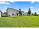 Expansive backyard showcasing a well-maintained lawn, ideal for Gathering gatherings and recreation at 14403 Dunrobin Dr, Wimauma, FL 33598