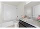Bathroom featuring a tub and vanity with dark cabinets at 14403 Dunrobin Dr, Wimauma, FL 33598
