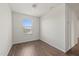 Bright bedroom with hardwood floors and a window with natural light at 14403 Dunrobin Dr, Wimauma, FL 33598