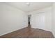 Bedroom features wood-look floors and closet at 14403 Dunrobin Dr, Wimauma, FL 33598