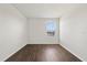 Bedroom featuring wood-look floors and a window at 14403 Dunrobin Dr, Wimauma, FL 33598