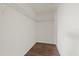 Walk-in closet featuring wood-look floor and wire shelving at 14403 Dunrobin Dr, Wimauma, FL 33598