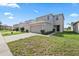 Beautiful two-story home featuring a two-car garage, manicured lawn, and inviting curb appeal at 14403 Dunrobin Dr, Wimauma, FL 33598
