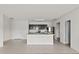 Open concept kitchen featuring a center island with bar seating and stainless steel appliances at 14403 Dunrobin Dr, Wimauma, FL 33598