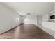 Bright living room with hardwood floors and neutral walls, creating a cozy space at 14403 Dunrobin Dr, Wimauma, FL 33598