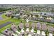 Aerial view of community reveals lush landscaping and manicured lawns at 14460 English Lavender Dr, Wimauma, FL 33598