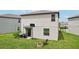 Cozy backyard with fire pit, grill, and basketball hoop creates an inviting space for outdoor living and entertainment at 14460 English Lavender Dr, Wimauma, FL 33598