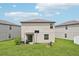 Spacious backyard features a basketball hoop, grill and cozy firepit area perfect for outdoor gatherings at 14460 English Lavender Dr, Wimauma, FL 33598