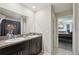 Stylish bathroom featuring a double sink vanity and a unique lion-themed shower curtain at 14460 English Lavender Dr, Wimauma, FL 33598