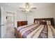 This bedroom boasts a ceiling fan, carpet, closet, and dresser for ample storage and comfort at 14460 English Lavender Dr, Wimauma, FL 33598