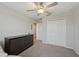 Cozy bedroom with ceiling fan and closet, designed for optimal comfort and storage at 14460 English Lavender Dr, Wimauma, FL 33598