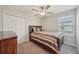 Comfortable bedroom with a large closet and a queen-size bed featuring elegant bedding at 14460 English Lavender Dr, Wimauma, FL 33598