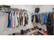 Organized walk-in closet with ample storage space for clothing and shoes at 14460 English Lavender Dr, Wimauma, FL 33598