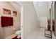 Bright entryway featuring a tiled floor, a tall ceiling, and decorative mirrors, with access to powder room at 14460 English Lavender Dr, Wimauma, FL 33598