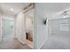 Upstairs hallway leads to the laundry room and other bedrooms for a convenient layout at 14460 English Lavender Dr, Wimauma, FL 33598