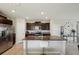Kitchen with stainless steel appliances and a large island with seating at 14460 English Lavender Dr, Wimauma, FL 33598