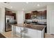 Modern kitchen features stainless steel appliances and granite countertops at 14460 English Lavender Dr, Wimauma, FL 33598