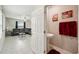 Open living area with tile flooring and modern decor, viewed from the attached powder room at 14460 English Lavender Dr, Wimauma, FL 33598