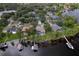 Scenic view of waterfront homes with boat docks along the lake at 15012 Maurine Cove Ln, Odessa, FL 33556