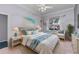 Cozy bedroom with warm natural light, coastal decor, and comfortable furnishings at 15012 Maurine Cove Ln, Odessa, FL 33556