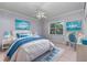 Bright bedroom with nautical decor, desk, and comfortable furnishings at 15012 Maurine Cove Ln, Odessa, FL 33556