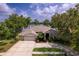 Attractive single-story home with a well-maintained lawn and three car garage at 15012 Maurine Cove Ln, Odessa, FL 33556