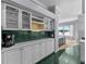 Kitchen with lots of cabinet space, wine rack, bar area, and view to the water at 15012 Maurine Cove Ln, Odessa, FL 33556