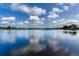 A panoramic view of the expansive lake, showcasing the waterfront property at 15012 Maurine Cove Ln, Odessa, FL 33556