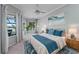 Beautifully staged main bedroom boasts bay windows, water view and coastal decor at 15012 Maurine Cove Ln, Odessa, FL 33556